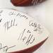 Autographed footballs wait for more signatures during the Mott Takeover at 1050 WTKA on Friday, May 17, 2013. Melanie Maxwell I AnnArbor.com